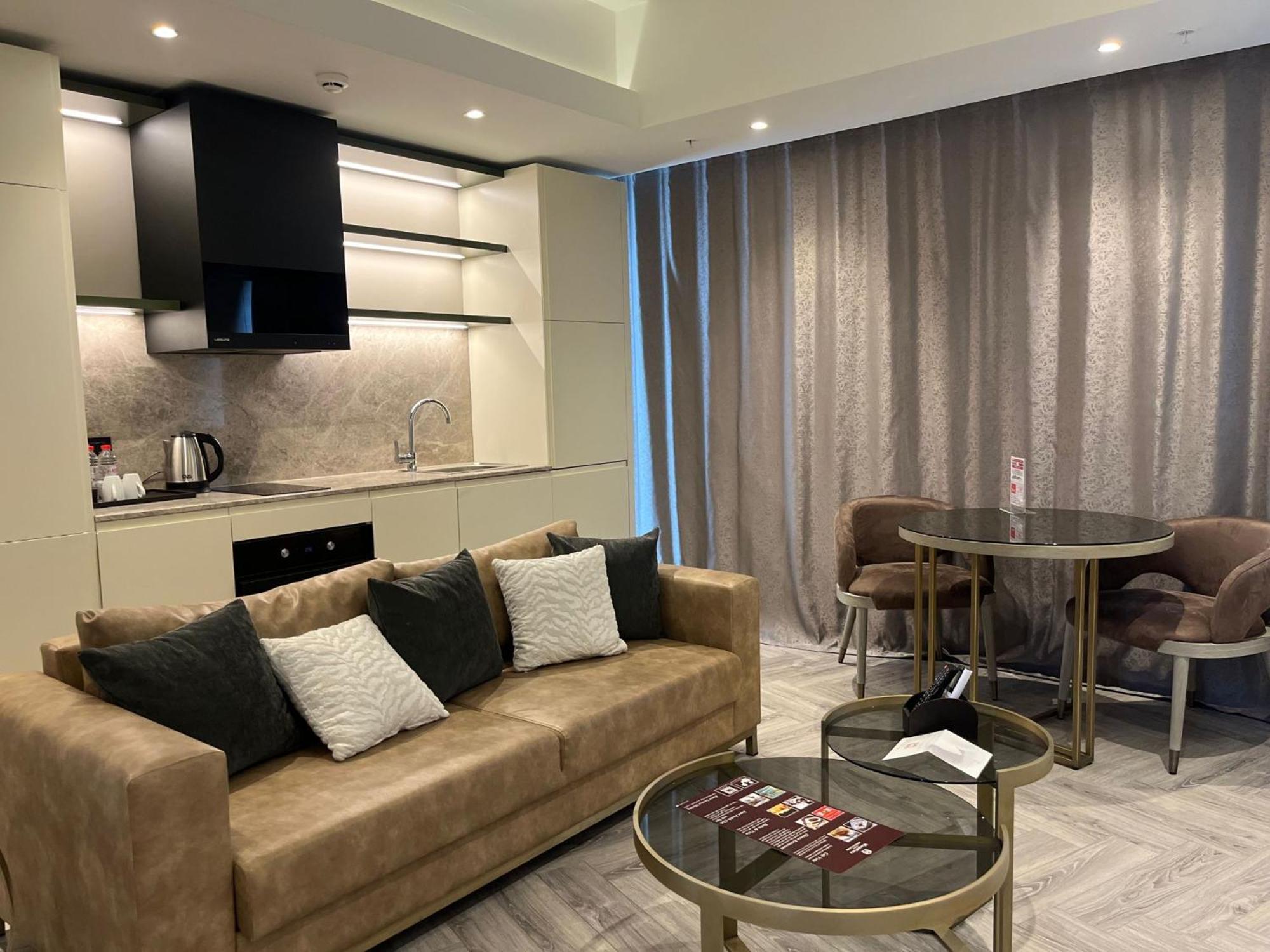 Wanda Vista Istanbul Hotel Exterior foto A living room at the hotel